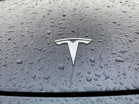 The Tesla logo on the hood of a car in Oslo