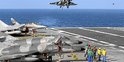 A Rafale fighter lands on the deck of France's flagship Charles de Gaulle aircraft carrier March 26, 2011. The Charles de Gaulle ran 47 air sorties against targets in Libya as France participates in the NATO no fly zone.  REUTERS/Benoit Tessier (FRANCE - Tags: MILITARY CONFLICT)