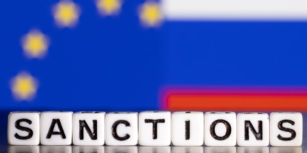 Illustration du mot sanctions devant les drapeaux de l'union europeenne et de la russie[reuters.com]