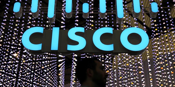 A man passes under a cisco logo at the mobile world congress in barcelona[reuters.com]