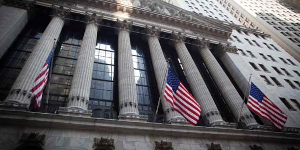 The exterior of the new york stock exchange is pictured with u.s. flags flying in new york[reuters.com]
