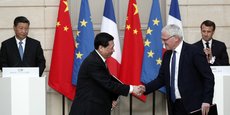 Paris, le 25 mars 2019. Jean-Bernard Lévy (au premier plan, à dr.), PDG d'EDF, lors d'une cérémonie de signature de deux accords portant sur des projets bas carbone en Chine.