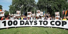 Photo d'illustration : le 23 juillet dernier, à 100 jours du début du sommet sur le climat COP26, des manifestants de la Coalition pour le climat manifestent, à Parliament Square, Londres.
