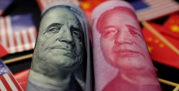 La chine laisse le yuan enfoncer le seuil de 7 pour un dollar